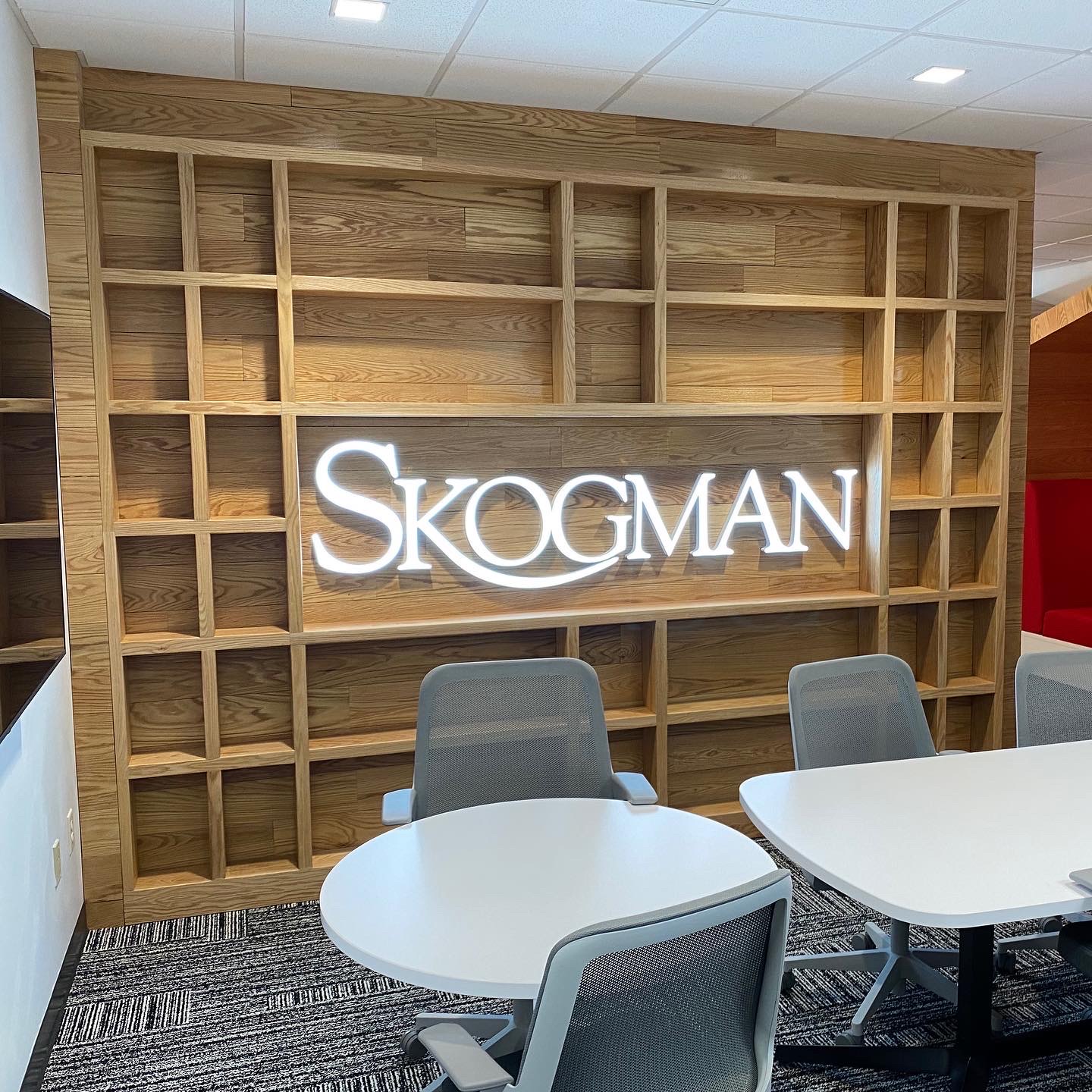 Custom built-in shelving with backlit signage